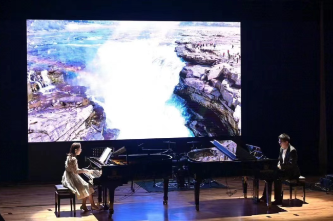 9李音莉与陈天行演奏《黄河》钢琴协奏曲第二乐章.png 图片